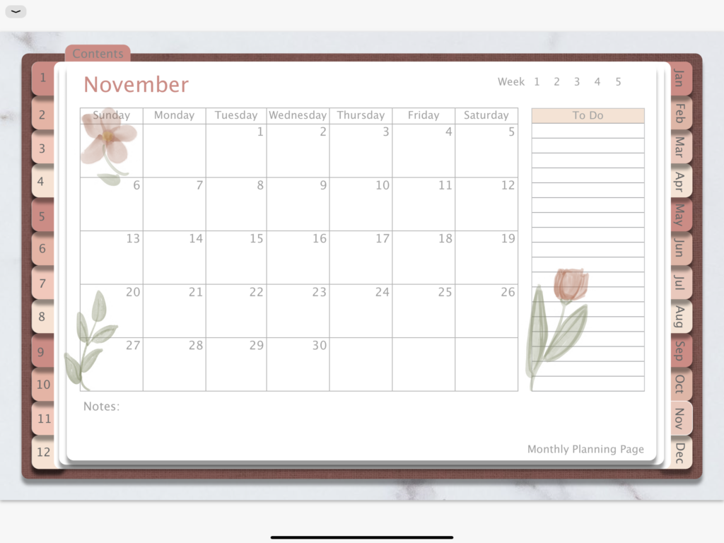 Dated 2022 Digital Planner monthly planner page with a rose gold color palatte