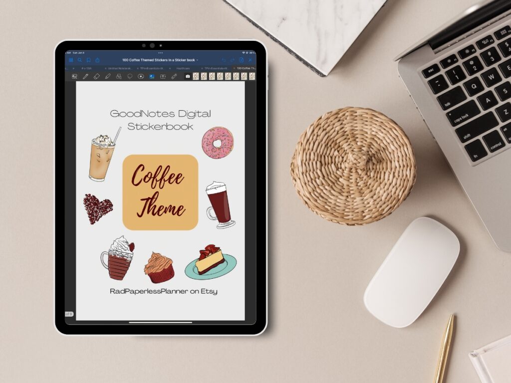 iPad sitting on a desk with Goodnotes open showing coffee themed digital sticker book